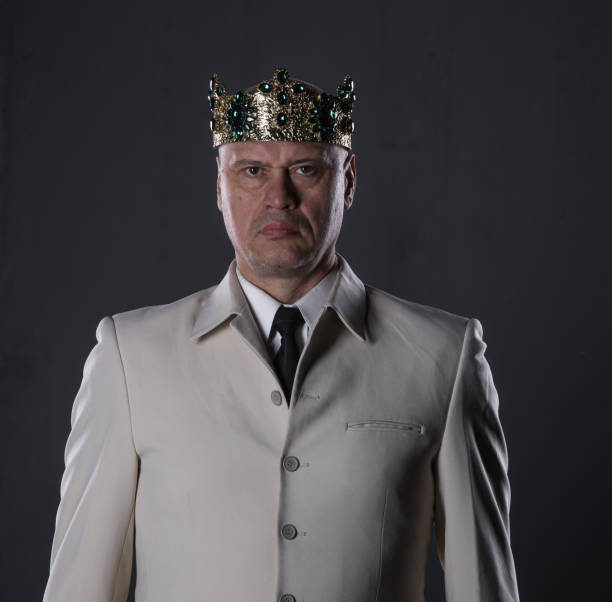 istock man in a white suit with a crown 1052358726