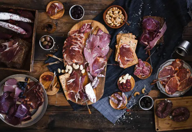 Spanish cured meat, hamon, lomo, chorizo, salchichon. Salumeria Buffet appetizers Charcuterie concept. Top view.