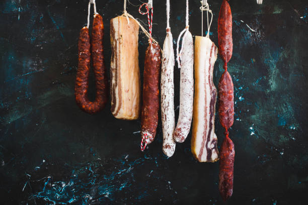 istock Assorted spanish Sausage salami hanging 1052367150