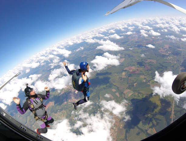istock Skydivers jumping out of plane, inside view. 1052368314