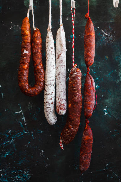 istock Variation dry Sausage salami hanging 1052369338