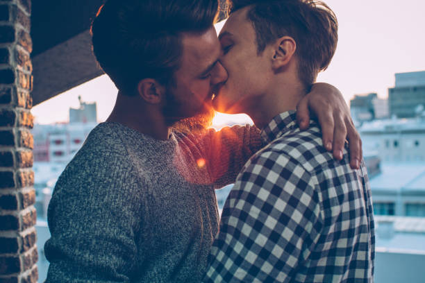 同性カップル - gay man homosexual men kissing ストックフォトと画像