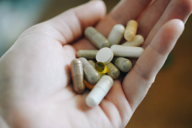 istock Handful of pills 1052389272