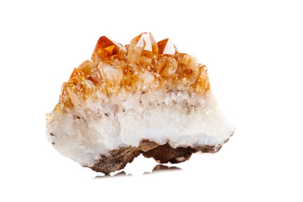 istock Macro mineral stone Citrine in rock in crystals on a white background 1052389932