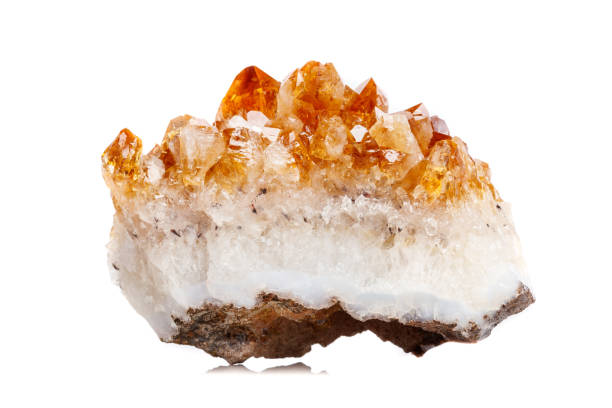istock Macro mineral stone Citrine in rock in crystals on a white background 1052390030