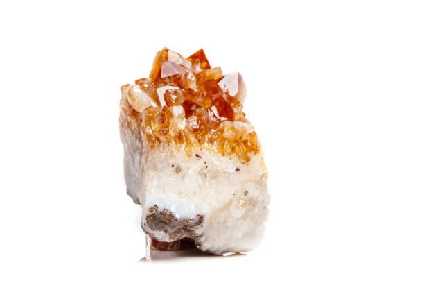istock Macro mineral stone Citrine in rock in crystals on a white background 1052390242