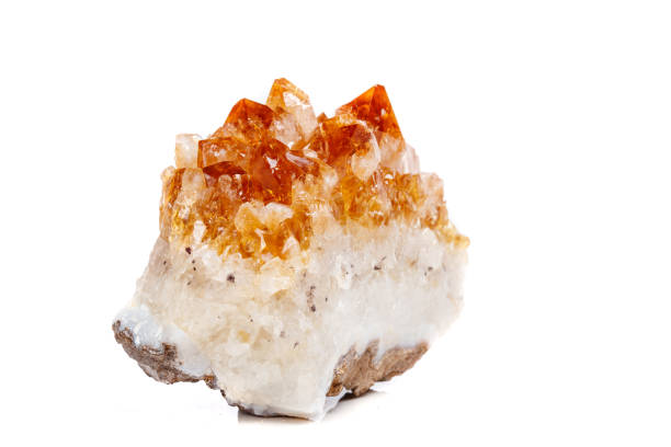 istock Macro mineral stone Citrine in rock in crystals on a white background 1052390246