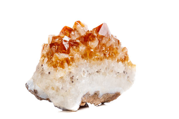 istock Macro mineral stone Citrine in rock in crystals on a white background 1052390398
