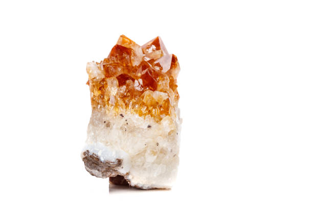 istock Macro mineral stone Citrine in rock in crystals on a white background 1052390850
