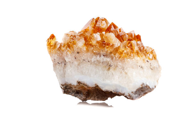 istock Macro mineral stone Citrine in rock in crystals on a white background 1052391196