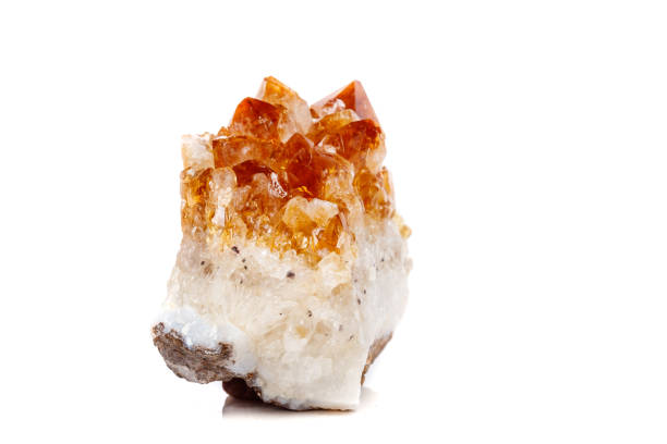istock Macro mineral stone Citrine in rock in crystals on a white background 1052391292