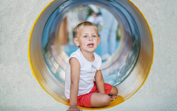 istock Little boy playing on the playground 1052396584