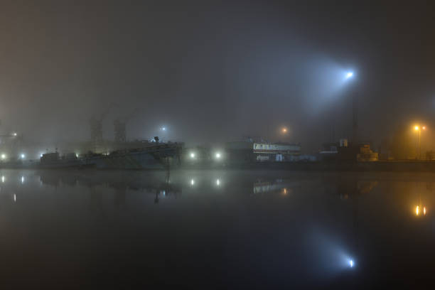 istock Cargo ships in the port with lights at night 1052424092