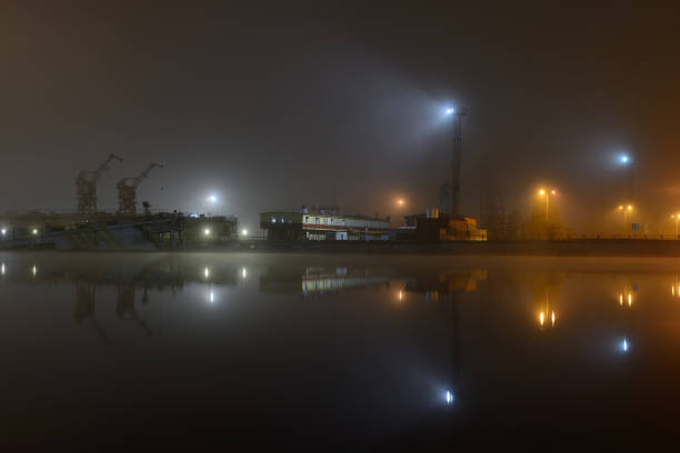 istock Cargo ships in the port with lights at night 1052424114