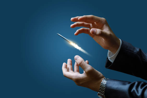 istock Businessman launches a missile on a blue background. 1052440628