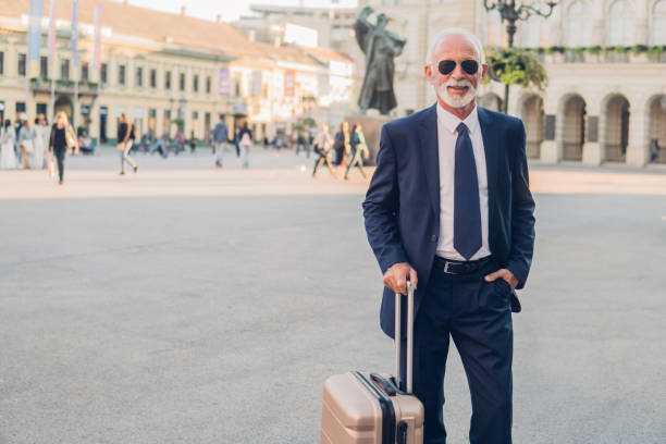 istock Older business man with a suitcase 1052459470