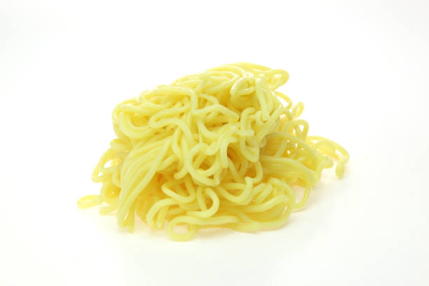 istock raw noodle for Chow mein in a white backgound 1052485650
