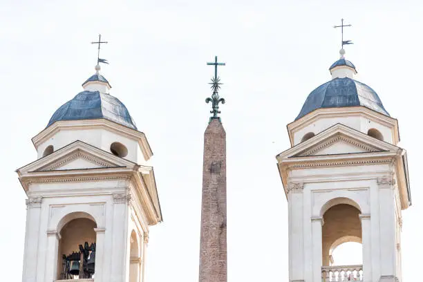 Rome, Italy historic city with church tower Santissima Trinita dei Monti bell, summer day isolated closeup with sky by Spanish Steps