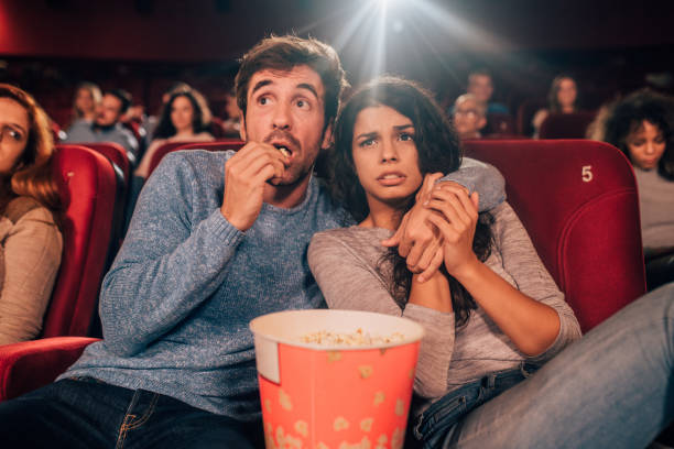 istock Scared couple hugging at cinema 1052497496