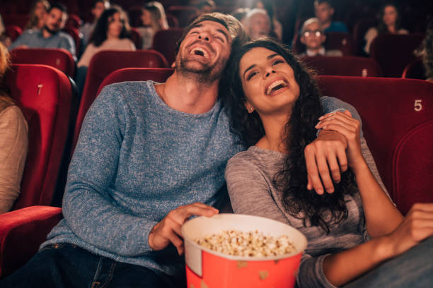 istock Laughing couple at cinema 1052503764
