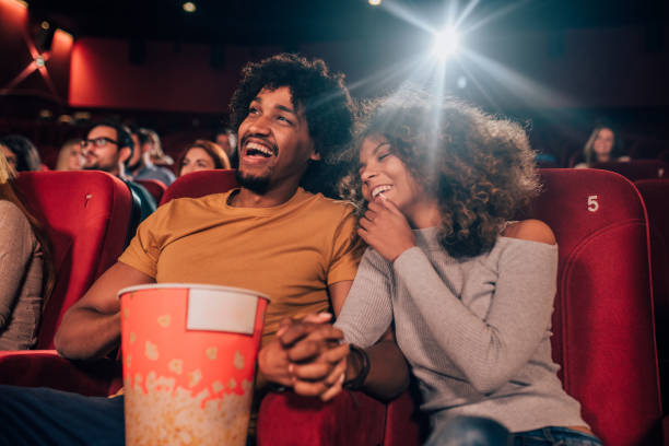 istock Couple holding hands in cinema 1052508074