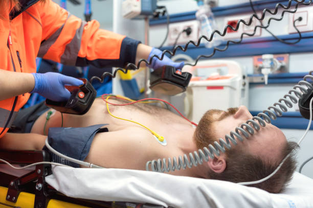 Medical urgency in the ambulance. Emergency doctor using defibrillator Medical urgency in the ambulance. Emergency doctor using defibrillator defibrillator photos stock pictures, royalty-free photos & images