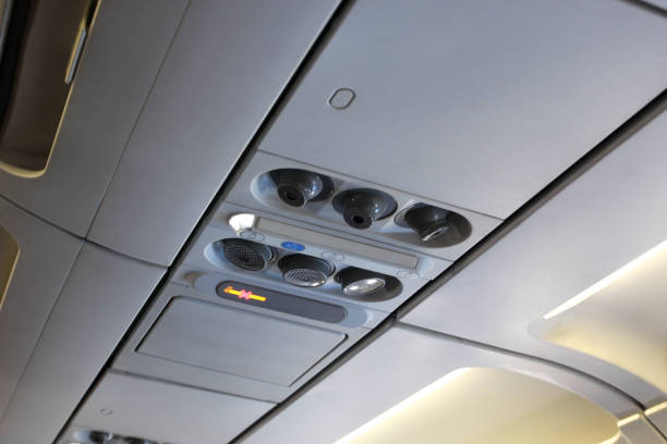 istock air grille diffuser and lamp on ceiling  in the airplane 1052592192