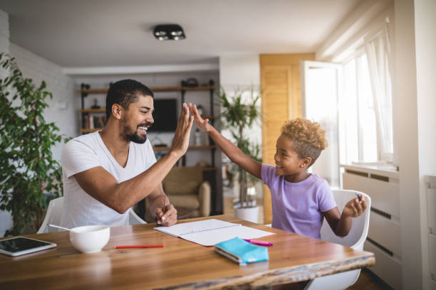 istock Father and daughter doing homework in the morning 1052592390