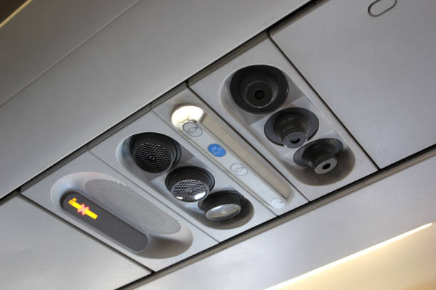 istock air grille diffuser and lamp on ceiling  in the airplane 1052597382