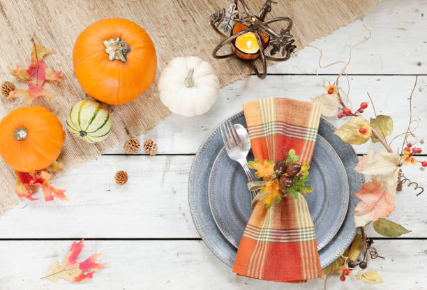 autumn holiday thanksgiving dining on an old wood table - flower arrangement dining room decor dining imagens e fotografias de stock