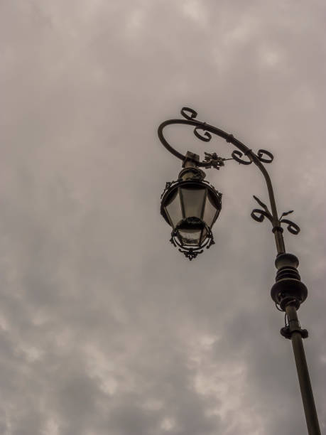 istock A retro lampost at a dark sky with clouds 1052607254