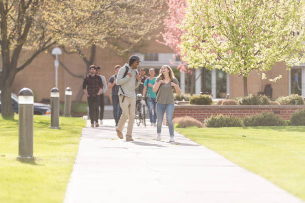 istock College students walking across campus to their classes 1052619208