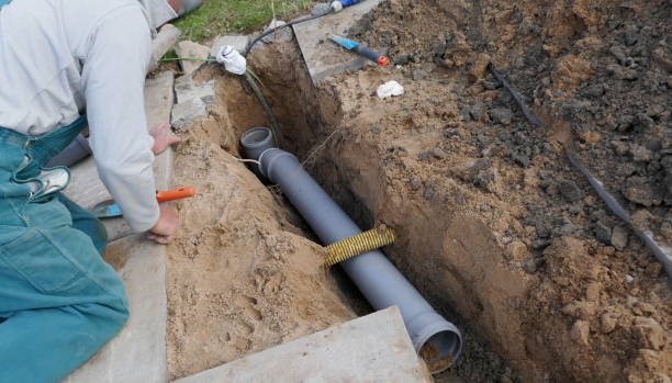 Laying and installation of a sewer pipe Laying and installation of a PVC sewer pipe pvc conduit stock pictures, royalty-free photos & images