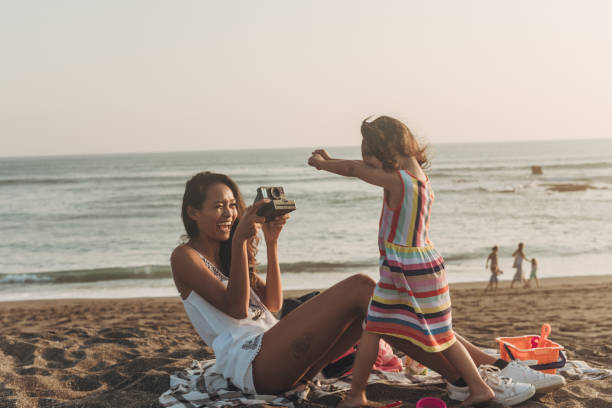 istock Family photographing on beach 1052649248
