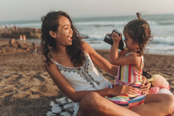 istock Daughter photographing mom 1052649276