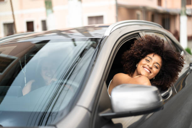 istock Woman Driver Portrait at Car Interior 1052666472