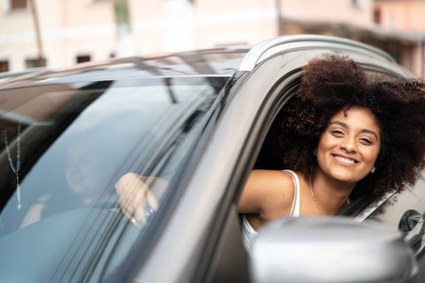 istock Woman Driver Portrait at Car Interior 1052666498