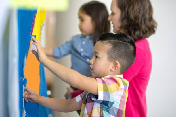 istock Mom homeschooling her young children 1052666974