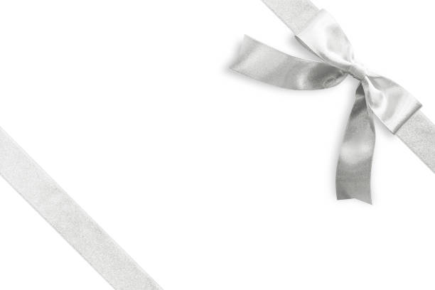 istock Silver bow satin ribbon band stripe fabric on corner (isolated on white background with clipping path) for Christmas holiday gift box present wrap design decoration ornament element 1052673332