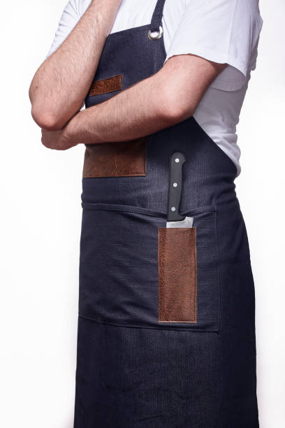 istock unrecognizable person, close up of one knife. chef uniform. 1052715620