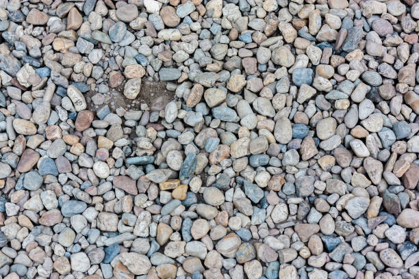 istock Natural colorful pebble (stones) background texture with copy space. 1052822450