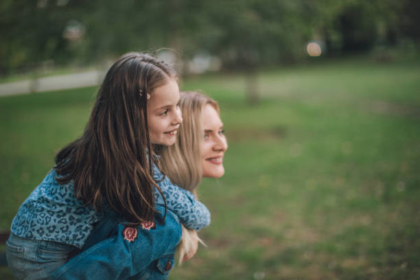 istock Child and mother fun time in park 1052825828