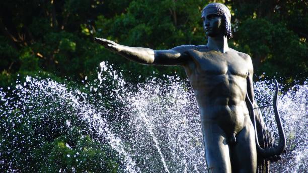 istock Men pointing right standing on a fountain 1052876634