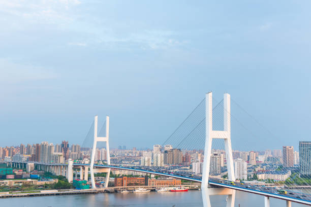 istock The city highway bridge on the river. 1052877054