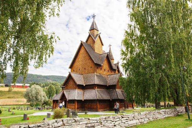 Old Stave church and cemetery in Norwegian village Heddal, Norway-August 15, 2014 -  Old Stave church and cemetery in Norwegian village. heddal stock pictures, royalty-free photos & images