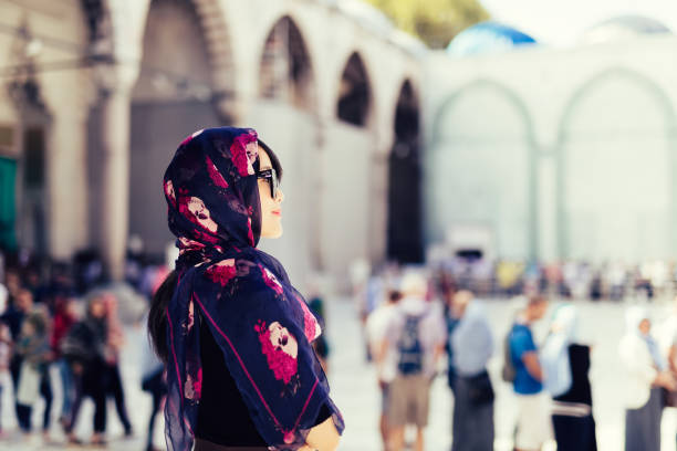 istock Woman visiting mosque in Istanbul, Turkey 1052886076