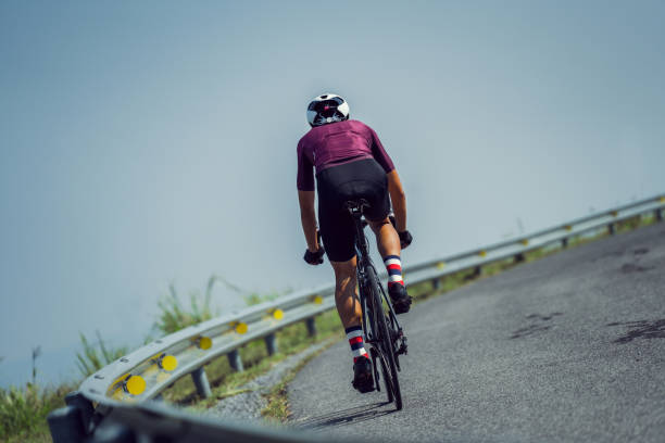 istock Asian man cycling in the morning.Image from the back 1052886186
