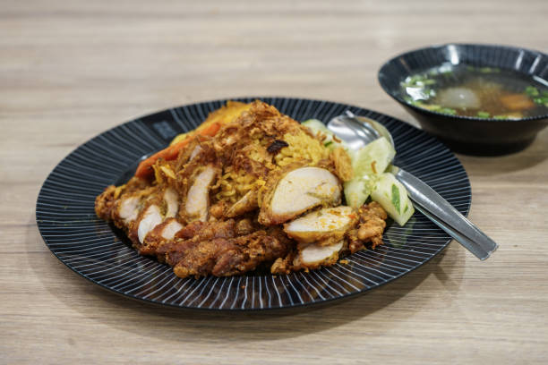 istock Rice with fried chicken with curry and soup 1052890706