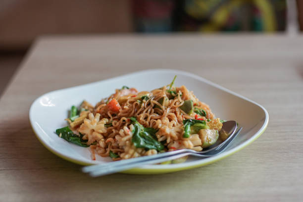 istock fried noodle on white plate in resturant 1052890858