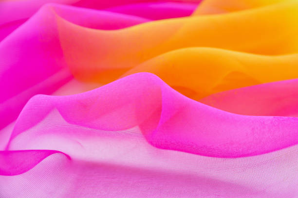 istock Texture chiffon fabric pink and yellow  color for backgrounds 1052890862